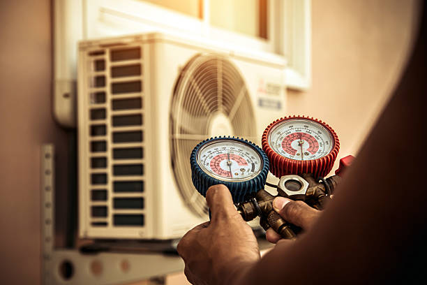 Professional Air Conditioning Service technician working in Forsyth, MO
